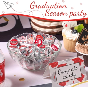 Close-up of Class of 2025 graduation stickers on chocolate candy for party favors