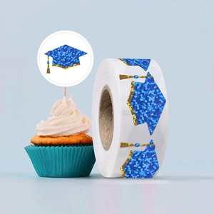Macro detail of blue glitter graduation cap stickers used for cake toppers and sealing