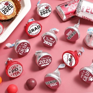 Detail of 2025 graduation stickers for candy packaging on a clean pink surface