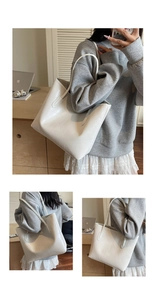Vue détaillée du sac cabas blanc à motif crocodile porté comme un sac à bandoulière