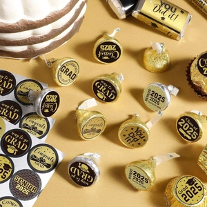Close-up of Class of 2025 graduation stickers on chocolate treats for party favors