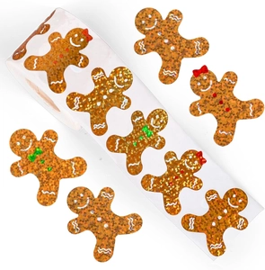 Macro detail of gingerbread man laser stickers with sparkling glitter and textured finish