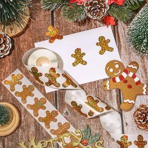 Glittery gingerbread man stickers for Christmas decoration on rustic wood background