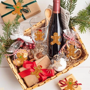 Gingerbread man stickers applied to Christmas gift boxes, glass cups, and bottle packaging