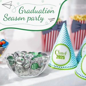 Close-up of Class of 2025 graduation stickers and party hats with festive blue patterns