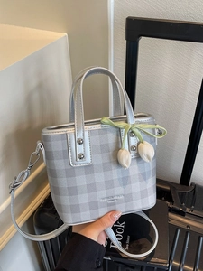 Silver-grey checkered bucket bag with tulip charm and crossbody strap for women