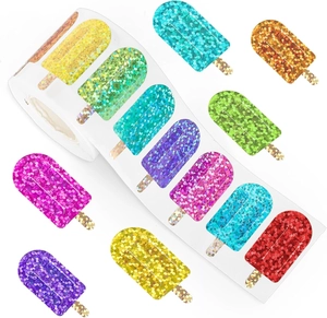 Macro detail of colorful glitter popsicle stickers on a roll for stationery decoration