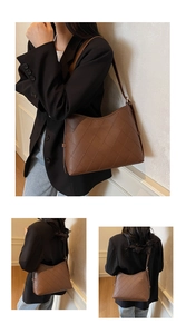 Detailed view of brown quilted tote bag with classic diamond stitching and slim shoulder strap