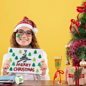 Green glitter Christmas tree stickers used for facial decor, cards, and gift wrapping