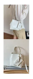 Detail of cream pleated leather handbag with mini coin purse and silver logo