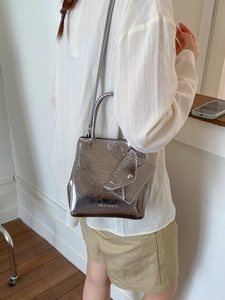 Silver metallic textured handbag with pleated finish and matching envelope pouch charm