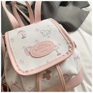 Detail of lychee leather backpack with floral bear prints and Sunny Day Seoul logo