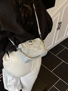 Minimalist light blue quilted crossbody bag with stylish silver chain strap for women