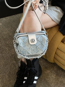 Blue denim quilted box bag with silver accents and metal chain strap for women