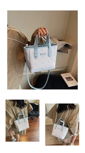 Detail of light blue printed tote bag with deer patterns and adjustable shoulder strap