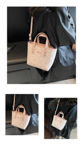 Detail of printed deer pattern mini tote bag with adjustable shoulder strap and handles