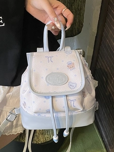 Mini pastel blue and beige backpack featuring cute bear prints and drawstring closure