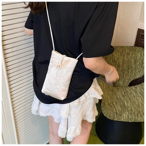 Detailed embroidery of plum blossoms and window patterns on the small silk crossbody bag
