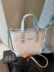 Floral deer print mini tote bag in blue and beige with adjustable shoulder strap