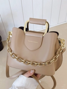 Elegant beige PU leather bucket bag with gold metal handle and chain strap for women