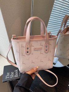 Pink and beige bucket tote bag with deer pattern and detachable shoulder strap