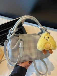 Silver-gray plaid pleated handbag with long strap and yellow plush pendant charm