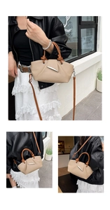 Detail of minimalist beige pebble leather handbag with brown knotted handle and silver clasp