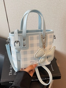 Blue plaid pattern mini tote bag with dog charm and adjustable shoulder strap