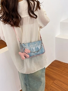 Retro denim blue underarm bag with pink leather trim and silver metal chain strap
