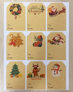 Flat lay of nine vintage kraft Christmas gift tags with Santa and Reindeer designs
