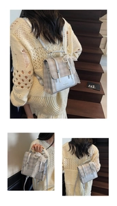 Detail of grey plaid mini backpack featuring a pearl bow charm and glossy PU texture