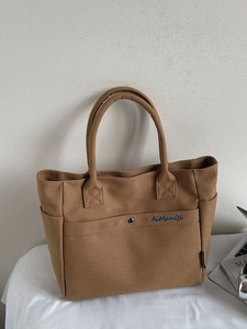 Caramel large canvas tote bag with embroidered logo and button closure for daily use