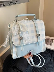 Light blue plaid backpack with a large lace bow and elegant pearl charm for women