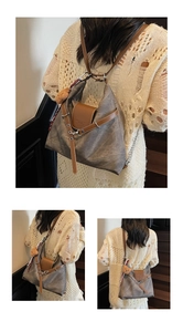 Detail of vintage canvas backpack with brown leather trim, metal rivets and bear charm