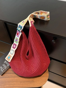 Large red knit hobo bag with bohemian floral strap and hollow mesh crochet design