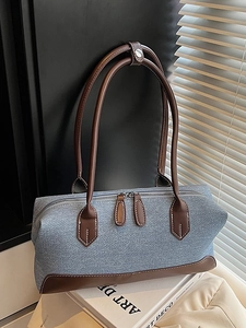 Large denim shoulder tote bag with brown leather trim and contrast stitching details
