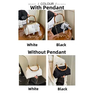 Detail view of lace shell bag with bamboo handle in black and white options