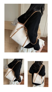 Détail d'un sac cabas chic en cuir crème et marron avec surpiqûres contrastées