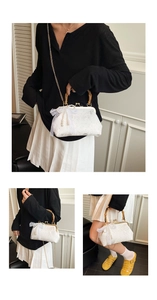 Detail of vintage white lace handbag featuring a bamboo handle and pearl tassel accents