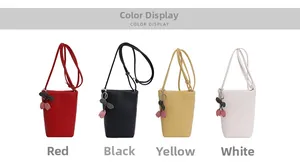 Mini crossbody bags in four colors featuring cherry charms and lychee texture