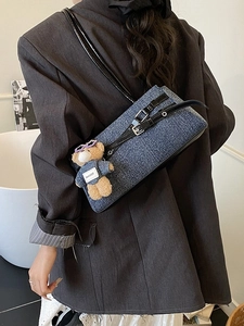 Blue denim texture shoulder bag with black strap and cute plush bear charm for women