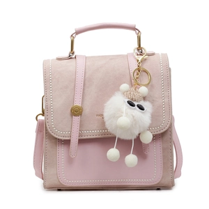 Chic pink multi-functional backpack with white bead trim and cute plush charm detail