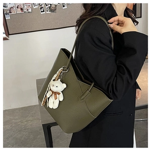 Olive green pebbled leather tote bag with teddy charm and silk scarf detail