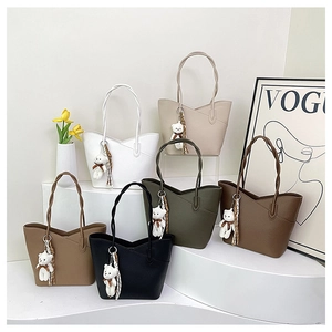 Detailed collection of minimalist leather bucket bags in six colors with bear charms
