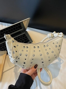 White crescent dumpling bag with silver studs and knotted handle for women