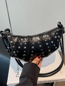 Black leather croissant bag with silver rivets and knotted strap for women