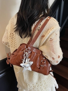 Brown patent leather shoulder bag with wrinkle texture and cute balloon dog charm