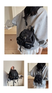 Detail view of mini denim backpack featuring Sanrio style bow and silver metal hardware