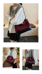Close-up of quilted contrast tote bag with gold chain strap and turn-lock detail