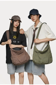 Workwear style large canvas tote bags shown in coffee and army green colors